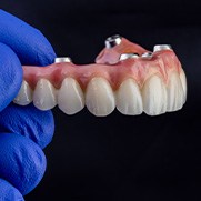 Implant dentures against a black background