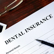 Dental insurance form on a wooden table